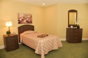 ICQ Popular Suite - photo of bed, nightstand and dresser