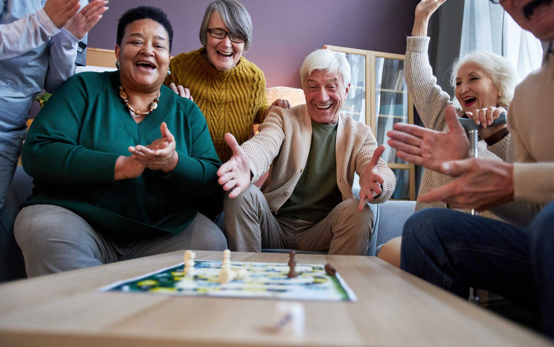 Residents playing a board game together