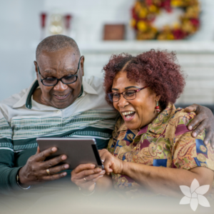 senior couple looking at tablet together and smiling