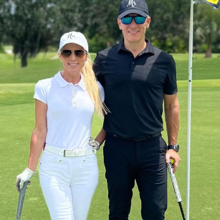 Sevy Petras on golf course with her husband.