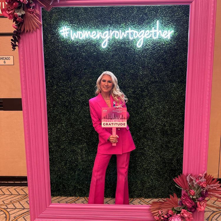Sevy Petras in a stylish pink suit.
